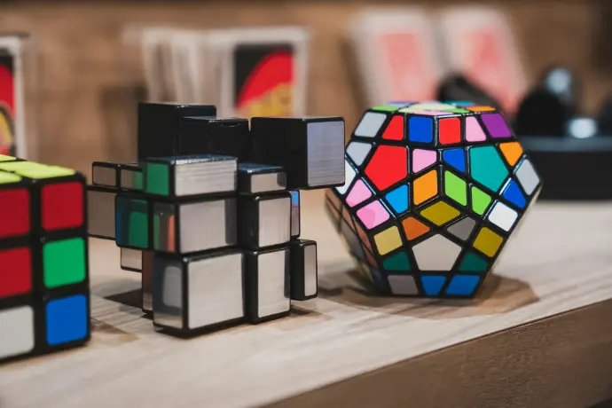 a group of rubik cubes sitting on top of a table